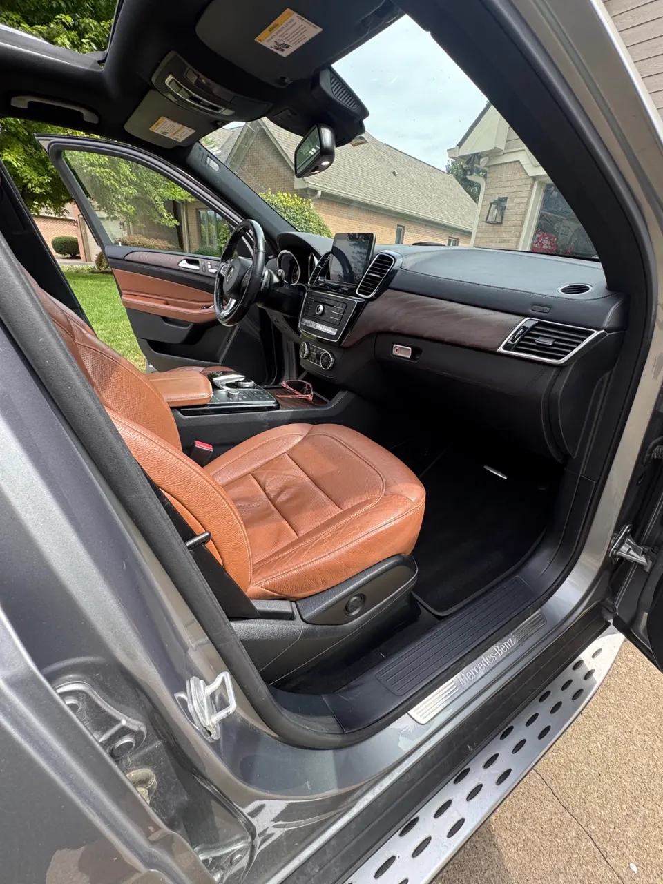 Passenger side interior of a Mercedes-Benz GLE after detailing, dash, wood trim and sill cleaned