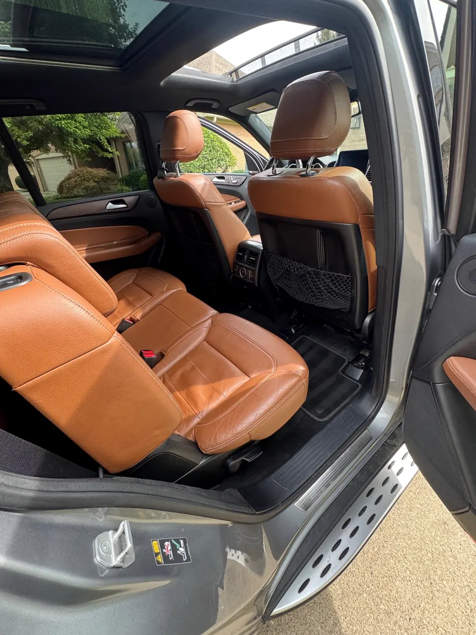 Rear bench of a Mercedes-Benz GLE detailed, leather seats conditioned and carpets vacuumed